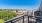 patio with view of a city with trees