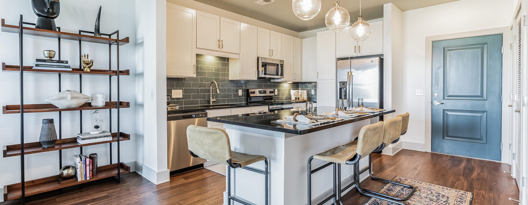 a kitchen with a dining table and chairs